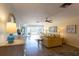 Inviting living room with modern furniture and a view of the balcony at 5630 Golf Pointe Dr # 206, Sarasota, FL 34243