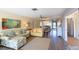 Bright living room showcasing the open floorplan and a decorative mirror wall at 5630 Golf Pointe Dr # 206, Sarasota, FL 34243