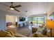 Comfortable living area with a view of the green golf course at 5630 Golf Pointe Dr # 206, Sarasota, FL 34243
