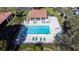 Overhead view of a rectangular swimming pool surrounded by lounge chairs at 5630 Golf Pointe Dr # 206, Sarasota, FL 34243