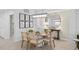 Well-lit dining area with stylish decor, a modern chandelier, and comfortable seating at 5632 Summit Pointe Cir # 101, Bradenton, FL 34210