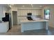 Bright kitchen featuring a large island, ample counter space, and modern stainless steel appliances at 5632 Summit Pointe Cir # 101, Bradenton, FL 34210
