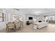 Open-concept living area with stylish dining set, modern lighting, and access to the outdoor patio at 5632 Summit Pointe Cir # 101, Bradenton, FL 34210