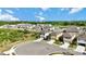 Aerial view of a two-story home in a neighborhood cul-de-sac with well-maintained landscaping and nearby amenities at 5800 Elegant Orchid Way, Sarasota, FL 34232