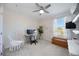 Cozy bedroom features a hanging chair, white trim, and modern desk with computer at 5800 Elegant Orchid Way, Sarasota, FL 34232