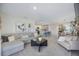 Open-concept living room showcases seamless flow to the kitchen, dining area, and neutral tones at 5800 Elegant Orchid Way, Sarasota, FL 34232