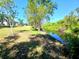 Scenic backyard bordered by a serene canal at 6631 63Rd E Ter, Bradenton, FL 34203