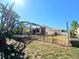 Backyard with screen enclosed patio and iron fence offers privacy and space at 6631 63Rd E Ter, Bradenton, FL 34203