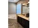Bright bathroom featuring double sinks, a large mirror, and a relaxing soaking tub at 6631 63Rd E Ter, Bradenton, FL 34203