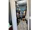 The walk-in closet provides ample storage, featuring built-in shelving, hanging rods, and hardwood-look floors at 6631 63Rd E Ter, Bradenton, FL 34203