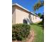 The home's side view with lush landscaping at 6631 63Rd E Ter, Bradenton, FL 34203