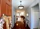 Light and airy foyer with polished wood floors, muted wall color and decorative lighting at 6631 63Rd E Ter, Bradenton, FL 34203
