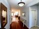 Stylish foyer with polished wood floors and tasteful decor sets the tone for a well-maintained home at 6631 63Rd E Ter, Bradenton, FL 34203