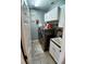 Convenient laundry room with washer, dryer, sink, and ample cabinet space at 6631 63Rd E Ter, Bradenton, FL 34203