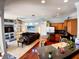 Open concept living area with a kitchen featuring stainless steel appliances, ideal for entertaining and everyday living at 6631 63Rd E Ter, Bradenton, FL 34203