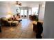 Spacious living room with tile flooring, leading to an open kitchen and a view of the backyard at 6631 63Rd E Ter, Bradenton, FL 34203