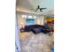 Spacious living room with tile floors and a large sectional sofa at 6631 63Rd E Ter, Bradenton, FL 34203