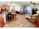 Open-concept living space with dining area, kitchen, and comfortable seating at 6631 63Rd E Ter, Bradenton, FL 34203