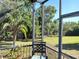 Relaxing backyard pool view showcasing lush greenery and waterfront tranquility at 6631 63Rd E Ter, Bradenton, FL 34203