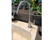 Close-up of a kitchen faucet, highlighting its sleek design and functionality at 6631 63Rd E Ter, Bradenton, FL 34203