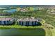 Scenic aerial view of the community with lush landscaping, water views, and residential buildings at 7005 River Hammock Dr # 402, Bradenton, FL 34212