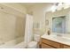 Inviting bathroom with a combined tub and shower, toilet, and a vanity area with decorative accents at 7005 River Hammock Dr # 402, Bradenton, FL 34212