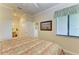 Bedroom showcasing a bed, adjacent bathroom access, and a window view, providing comfort and convenience at 7005 River Hammock Dr # 402, Bradenton, FL 34212