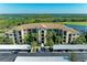 Exterior daytime shot of condo building with covered parking in front of building at 7005 River Hammock Dr # 402, Bradenton, FL 34212