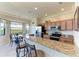 Well-equipped kitchen with granite countertops, stainless steel appliances, and ample counter space at 7005 River Hammock Dr # 402, Bradenton, FL 34212