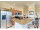 Kitchen with stainless steel appliances, granite countertops, and an island with barstool seating at 7005 River Hammock Dr # 402, Bradenton, FL 34212