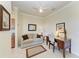Comfortable living room featuring a sofa, desk, and natural lighting, creating a cozy workspace at 7005 River Hammock Dr # 402, Bradenton, FL 34212
