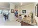 Inviting space with a seating area and a partial view of the kitchen area at 7005 River Hammock Dr # 402, Bradenton, FL 34212