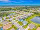 An aerial view of a neighborhood with multiple ponds and green spaces, highlighting the community's layout at 7107 58Th E Ter, Palmetto, FL 34221