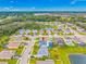 The aerial view shows a house within a neighborhood, close to ponds and green spaces for serene living at 7107 58Th E Ter, Palmetto, FL 34221