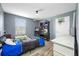 A bedroom with a window, ceiling fan and themed decor offers a cozy and playful atmosphere at 7107 58Th E Ter, Palmetto, FL 34221