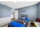 A bedroom with wood-look floors has a large dresser, and is decorated in a neutral palette at 7107 58Th E Ter, Palmetto, FL 34221