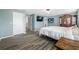 This spacious bedroom features wood-look floors and soothing colors, perfect for relaxation and rest at 7107 58Th E Ter, Palmetto, FL 34221