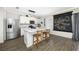 Bright kitchen with white cabinets, a breakfast bar, and modern appliances at 7107 58Th E Ter, Palmetto, FL 34221