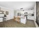 Kitchen with white cabinetry, island, stainless steel appliances, and wood-look tile flooring at 7107 58Th E Ter, Palmetto, FL 34221