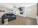 Inviting living room with fireplace, plush seating, and natural light at 7107 58Th E Ter, Palmetto, FL 34221