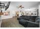 Open-concept living room featuring wood-look tile flooring and a cozy seating area with modern decor at 7107 58Th E Ter, Palmetto, FL 34221