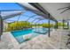 Enclosed pool area with covered patio and lush tropical landscaping at 7107 58Th E Ter, Palmetto, FL 34221