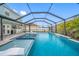 Enjoy outdoor living with a screened pool with spa and a covered lanai with a bar area at 7107 58Th E Ter, Palmetto, FL 34221