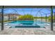 Backyard pool and spa with screened enclosure, offering a luxurious outdoor living space at 7107 58Th E Ter, Palmetto, FL 34221