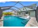 This screened pool with spa has a covered lanai with bar; ideal for entertaining friends and Gathering at 7107 58Th E Ter, Palmetto, FL 34221