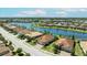 Aerial view of waterfront community, showcasing lush landscapes, and well-maintained homes at 7113 Whittlebury Trl, Bradenton, FL 34202