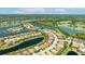 Community aerial view, showcasing homes nestled around lakes with lush green landscaping at 7113 Whittlebury Trl, Bradenton, FL 34202