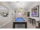 Spacious game room featuring a billiards table and stylish decor at 7113 Whittlebury Trl, Bradenton, FL 34202