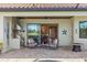 Outdoor patio area complete with an outdoor kitchen, fireplace, and lounge furniture at 7113 Whittlebury Trl, Bradenton, FL 34202