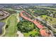 An aerial view shows the condos lining the beautiful golf course at Lakewood National at 7115 Boca Grove Pl # 204, Lakewood Ranch, FL 34202
